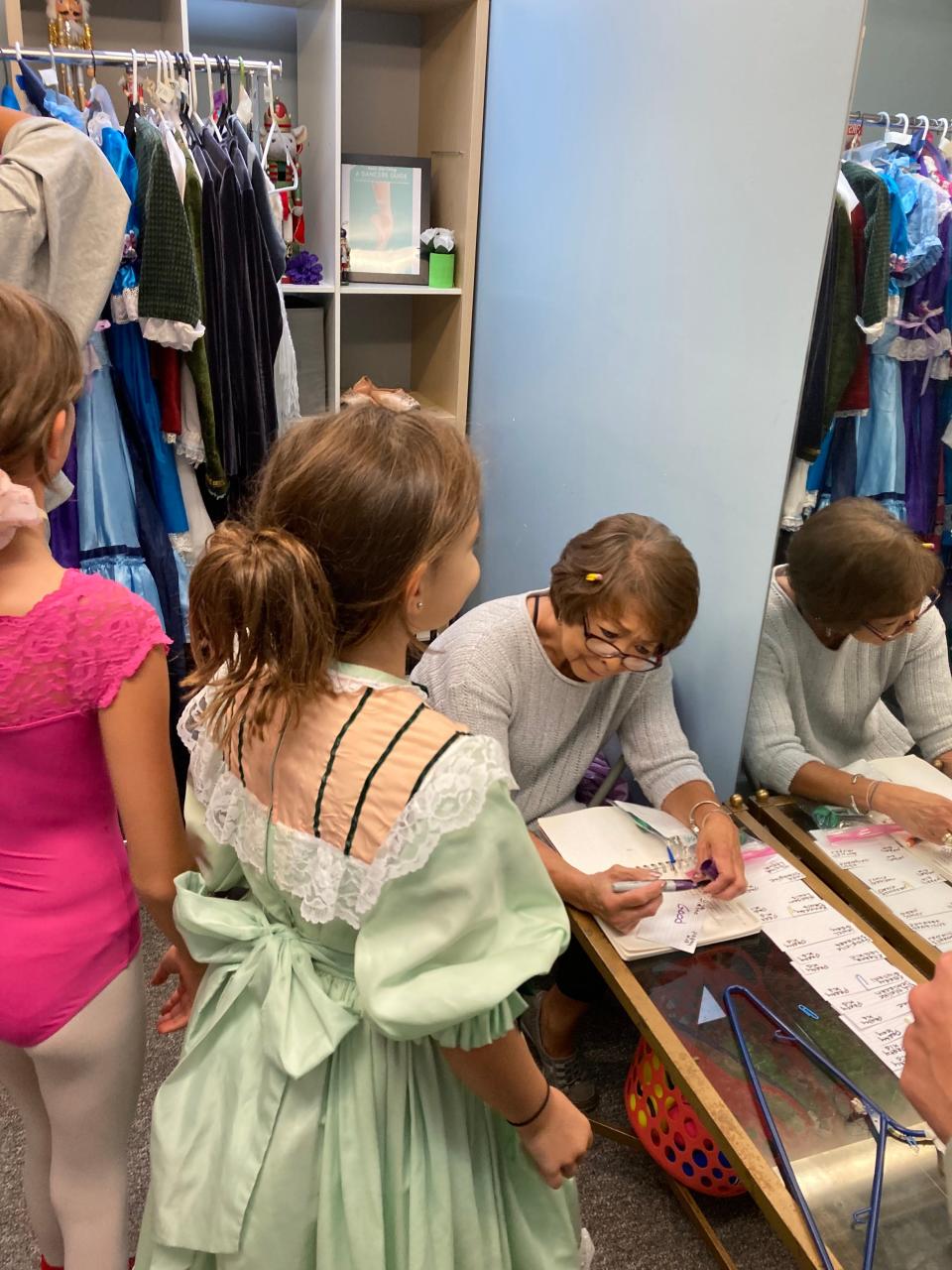 Karen Hostler takes meticulous notes and spends hours on alterations ensuring that every dancer looks the part for the holiday shows. Oct. 8, 2023.