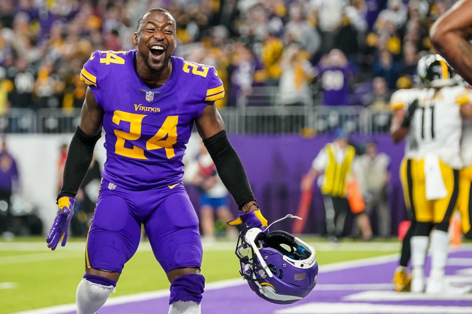 Vikings cornerback Mackensie Alexander celebrates during a game against the Steelers.