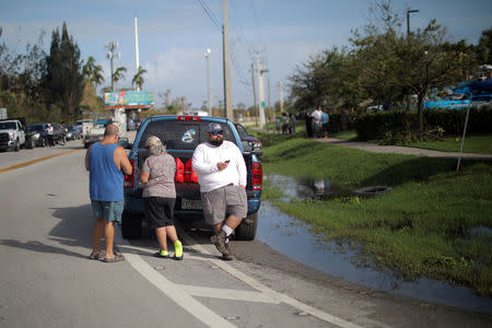 Local residents wait for the reopening of the entry road for the Florida Keys road after Hurricane Irma strikes Florida, in Homestead, Florida, U.S., September 11, 2017. REUTERS/Carlos Barria