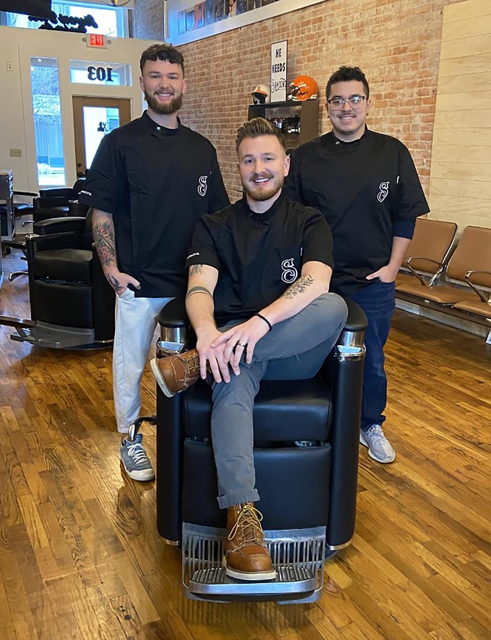 Stevens Bros. Barber Co. owner Oakley Stevens, seated, along with Parker Stevens and Alejandro Cancino.