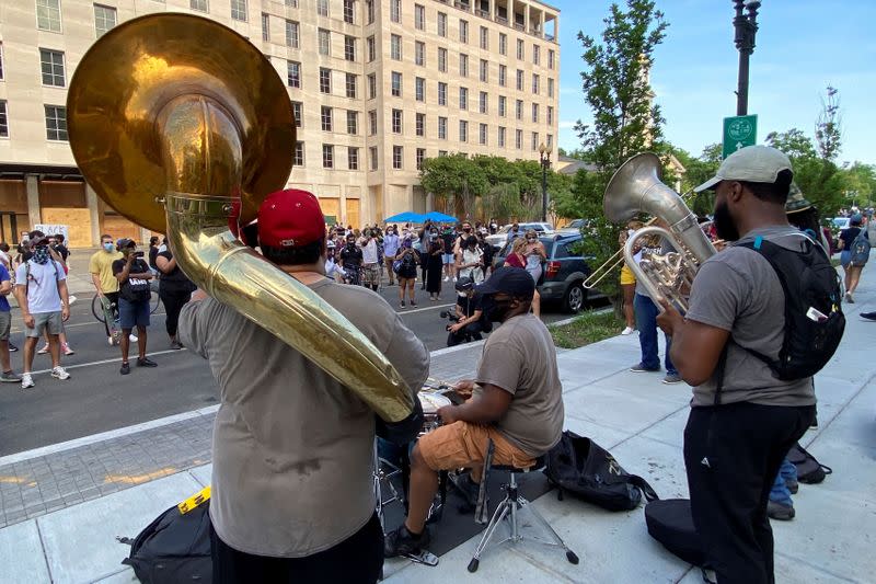 A brass band entertains protesters against the death in Minneapolis police custody of George Floyd in Washington