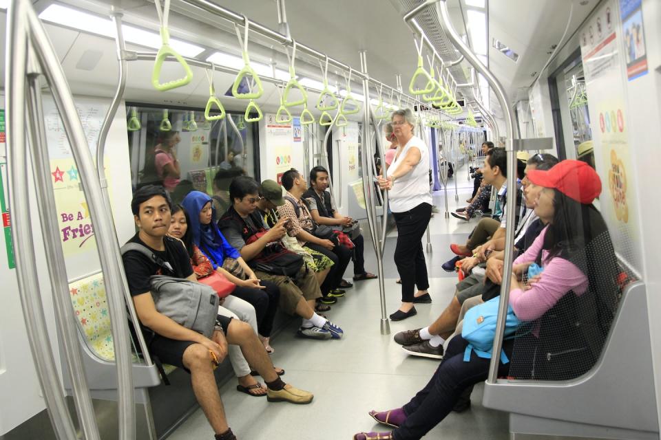 Tourist passengers in Singapore's public MRT (Mass Rapid Transit) train service (Photo: Getty Images)