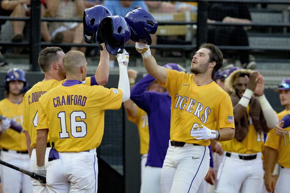 FILE - LSU utility Brayden Jobert (6) celebrates his home run with LSU infielder Collier Cranford (16) against Kennesaw St. during an NCAA regional baseball game on June 3, 2022, in Hattiesburg, Miss. LSU is the consensus No. 1 team in the preseason rankings after coach Jay Johnson upgraded the pitching staff through the transfer portal and brought in slugger Tommy White from North Carolina State. (AP Photo/Matthew Hinton, File)