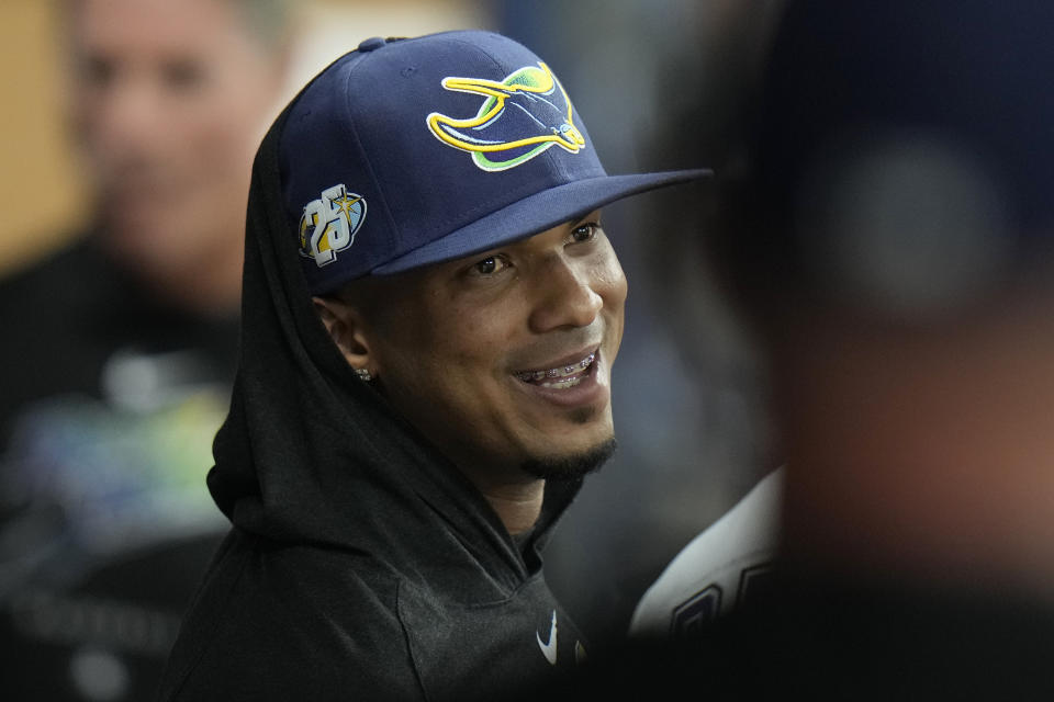 Tampa Bay Rays' Wander Franco smiles as he talks to Vidal Brujan in the dug out during the third inning of a baseball game against the Kansas City Royals Friday, June 23, 2023, in St. Petersburg, Fla. (AP Photo/Chris O'Meara)