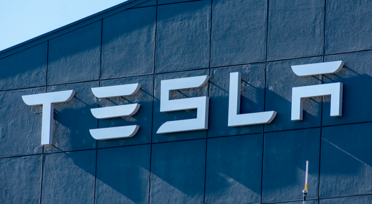 The Tesla (TSLA Stock) logo on the side of a building.