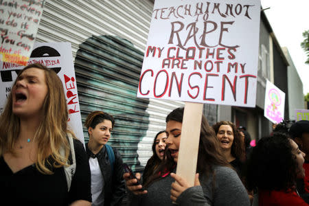 People participate in a protest march for survivors of sexual assault and their supporters in Hollywood, Los Angeles, California U.S. November 12, 2017. REUTERS/Lucy Nicholson