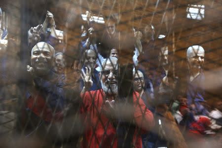 DEFIANT: Muslim Brotherhood members, including its Supreme Guide Mohamed Badie, centre, in court in Cairo in May. REUTERS/Mohamed Abd El Ghany