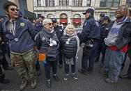 <p>Deportation protesters arrested as they supported the director of Judson Church’s New Sanctuary Coalition shout slogans as they wait for police to load them into squad cars and other police vehicles for transfer to booking, Jan. 11, 2018, in New York. (Photo: Kathy Willens/AP) </p>