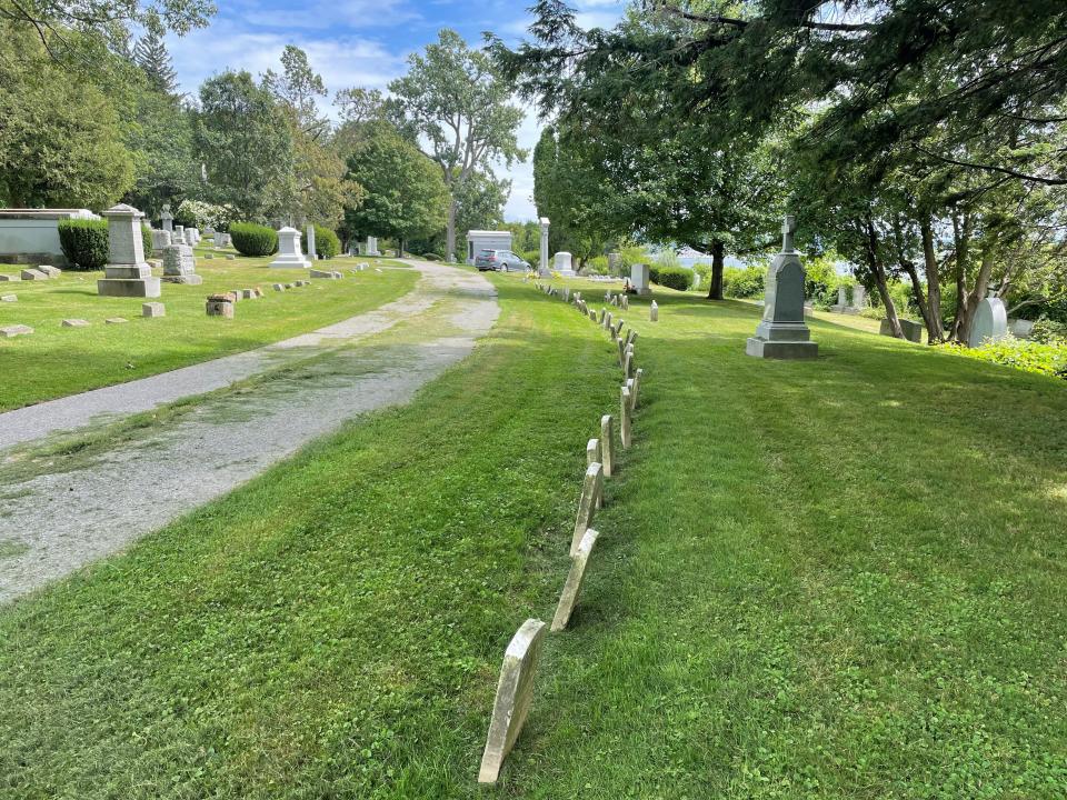 A line of gravestones from the late-1800s mark the lives of residents of the Home for Destitute Children, which housed children in Burlington between 1865 and 1941. The stones at Lakeview Cemetery will be restored and reset by volunteers from the Howard Center and the Vermont Old Cemetery Association on Sept. 10, 2022.