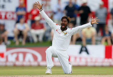 Cricket - England v Sri Lanka, First Test - Galle, Sri Lanka - November 6, 2018. Sri Lanka's Akila Dananjaya appeals for an unsuccessful LBW wicket for England's captain Joe Root (not pictured). REUTERS/Dinuka Liyanawatte