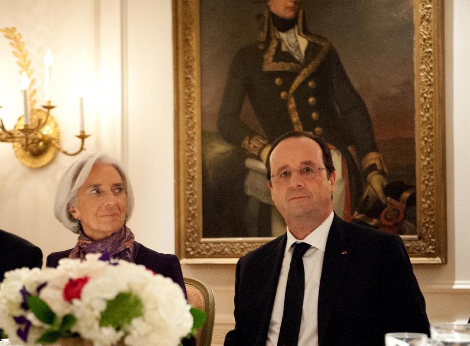 French President Francois Hollande, right, and International Monetary Fund managing director Christine Lagarde meet for dinner at the French ambassador's residence in Washington, Monday, Feb. 10, 2014, as Hollande begins a three-day visit to the U.S. (AP Photo/Nicholas Kamm, Pool)