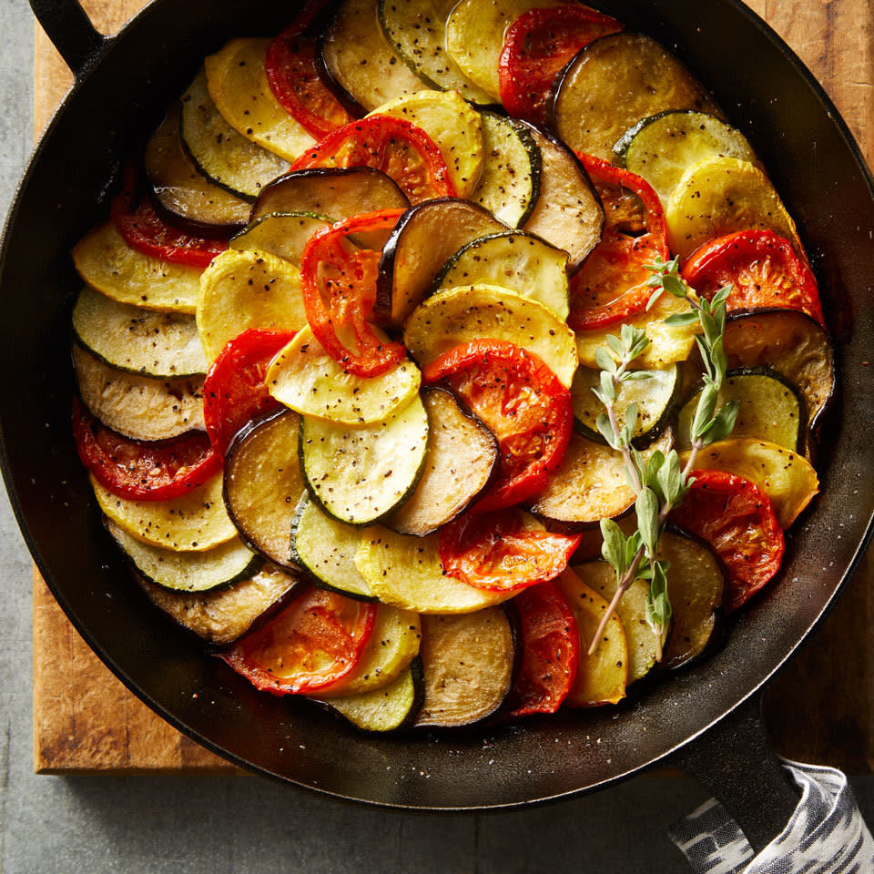 <p>Ratatouille, a classic French dish with tomatoes, eggplant, zucchini, bell pepper and onion, is frequently cooked low and slow until it turns silky and luscious. We kept the classic flavor but gave it a makeover by thinly slicing the vegetables and layering them in a cast-iron pan. We brighten up the flavor at the end with a splash of red-wine vinegar. <a href="https://www.eatingwell.com/recipe/265061/french-ratatouille/" rel="nofollow noopener" target="_blank" data-ylk="slk:View Recipe" class="link ">View Recipe</a></p>