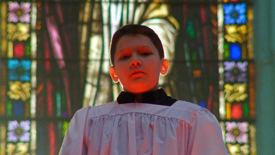 Boy dressed as an alter boy