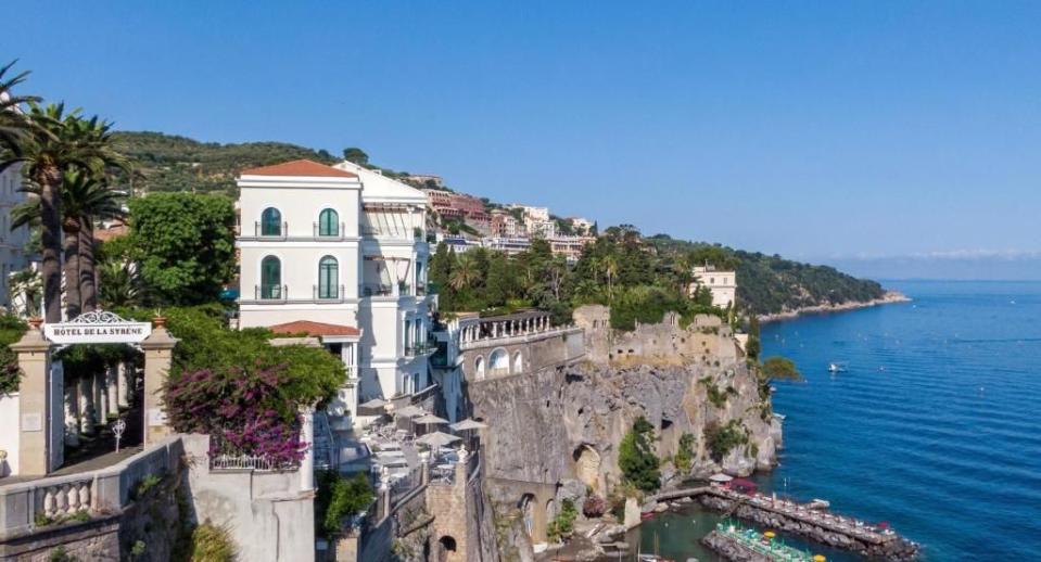 <p>Gaze over Mount Vesuvius and the beautiful Bay of Naples from the hot tub on your private terrace and you'll realise that life probably doesn't get better than this. A short wander from the colourful waterfront restaurants of Marina Grande, an ever-charming fishing village, this swish clifftop hotel built on the site of a Roman villa simply exudes Italian glamour, making it the perfect spot for a romantic week away. </p><p>There are 50 rooms and suites to choose from at <a href="https://www.booking.com/hotel/it/bellevue-syrene.en-gb.html%20?aid=1922306&label=best-hotels-sorrento" rel="nofollow noopener" target="_blank" data-ylk="slk:Bellevue Syrene;elm:context_link;itc:0;sec:content-canvas" class="link ">Bellevue Syrene</a>, almost all have fabulous sea views. Suite Pompeiana, which has a spacious terrace and a hot tub overlooking the bay is one of the best rooms in the house. If you can tear yourself away, the Club Lounge offers complimentary snacks and drinks (including wine and prosecco) throughout the day, while a moonlit dinner on the terrace is a romantic treat.</p><p><a class="link " href="https://www.booking.com/hotel/it/bellevue-syrene.en-gb.html%20?aid=1922306&label=best-hotels-sorrento" rel="nofollow noopener" target="_blank" data-ylk="slk:BOOK NOW;elm:context_link;itc:0;sec:content-canvas">BOOK NOW</a></p>