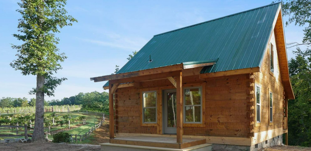 A cabin is on the property at 781 Payne Drive in Zirconia. The property is Kingdom Farms Vineyard, which is 129 acres, and is currently on the market for $5.495 million.