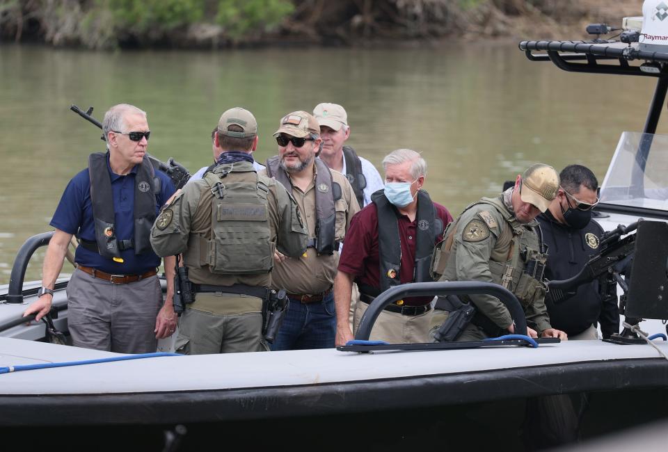 Sen. Ted Cruz (R-TX) and Sen. Lindsey Graham (R-SC) stand aboard a Texas Department of Public Safety boat for a tour of part of the Rio Grande river on March 26, 2021 in Mission, Texas. The senators are part of a Senate delegation visiting the Texas-Mexican border. (Photo by Joe Raedle/Getty Images)