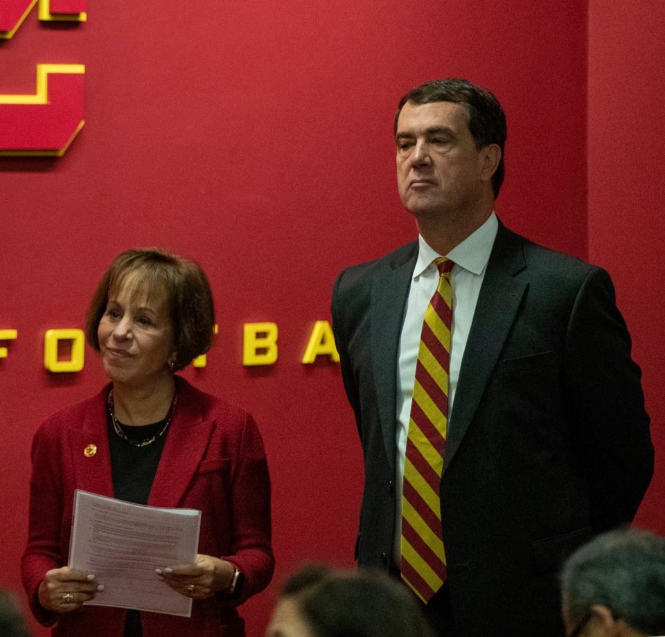 USC President Carol Folt, left, stands next to USC Athletic Director Mike Bohn during a news conference in November 2019.