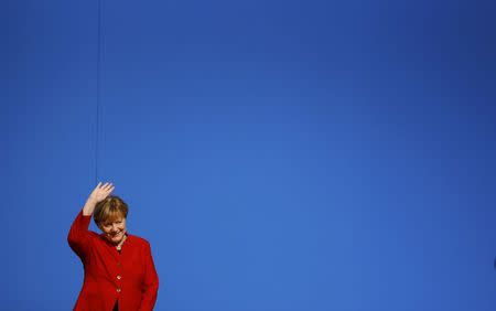 German Chancellor and leader of the conservative Christian Democratic Union party CDU Angela Merkel reacts after she was re-elected as chairwoman at the CDU party convention in Essen, Germany, December 6, 2016. REUTERS/Wolfgang Rattay