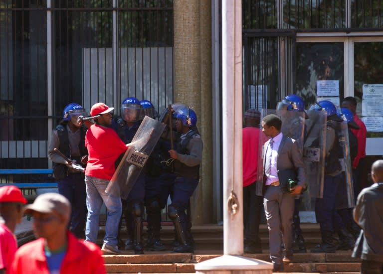 Dozens of police blocked off the site of an opposition rally to demand electoral reforms in Harare