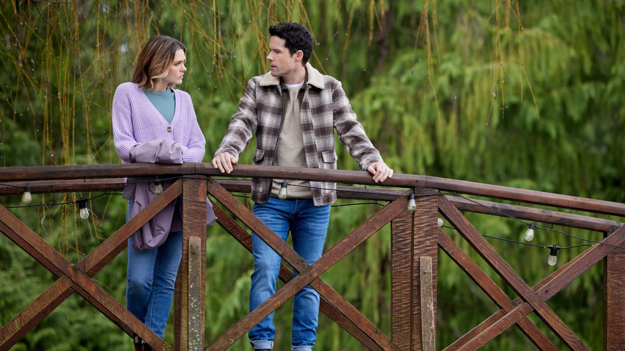  Aimee Teegarden, Benjamin Hollingsworth on a bridge in An Easter Bloom. 