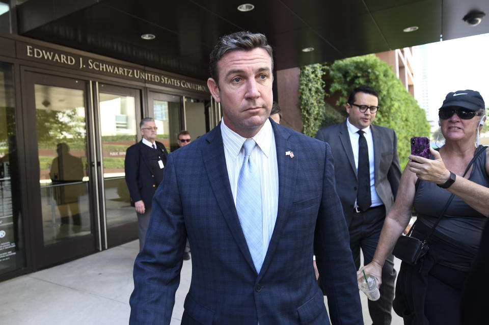 FILE - In this Monday, July 1, 2019, file photo, U.S. Rep. Duncan Hunter leaves federal court after a motions hearing in San Diego. On Tuesday, Dec. 22, 2020, President Donald Trump pardoned 15 people, including Hunter, who was sentenced to 11 months in prison after pleading guilty to stealing campaign funds and spending the money on everything from outings with friends to his daughter’s birthday party. (AP Photo/Denis Poroy, File)
