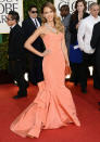 Celebrities in pastel fashion: Jessica Alba wore a coral Oscar de la Renta Pre-Fall 2013 dress to the Golden Globes.<br><br>© Getty