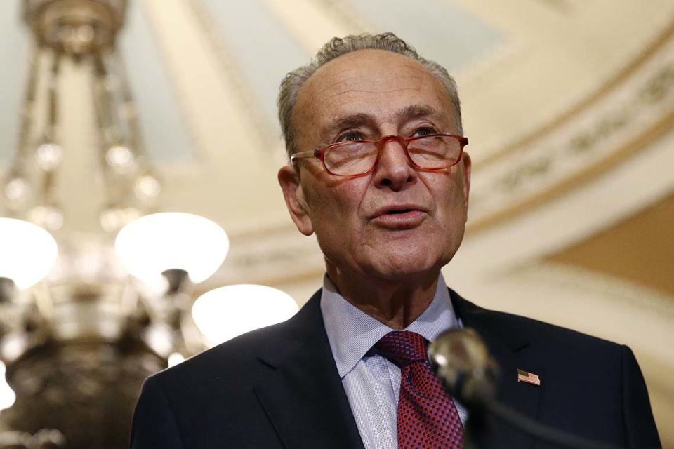 In this Oct. 22, 2019, photo, Senate Minority Leader Sen. Chuck Schumer of N.Y., speaks to members of the media following a Senate policy luncheon on Capitol Hill in Washington. Schumer is moving Democrats’ climate talk to where the rubber meets the road, proposing a $462 billion trade-in program to get millions of Americans out of climate-damaging gas vehicles and into electric or hybrid cars over the next decade. (AP Photo/Patrick Semansky)