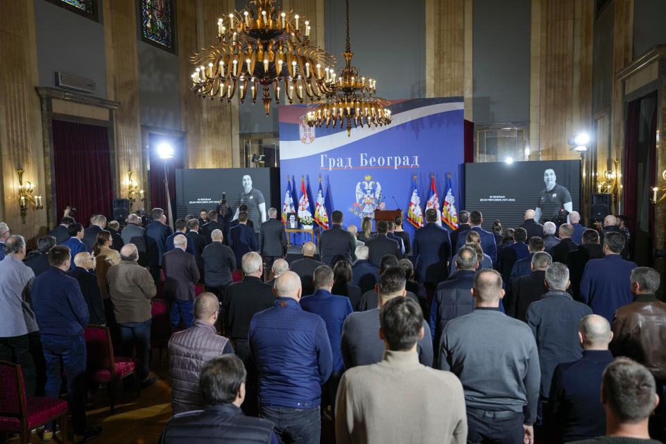 People hold a minute of silence for late Golden State Warriors assistant coach Dejan Milojevic during a commemoration ceremony in Belgrade, Serbia, Saturday, Feb. 10, 2024. Milojevic, 46, died on Jan. 17 in Salt Lake City. (AP Photo/Darko Vojinovic)