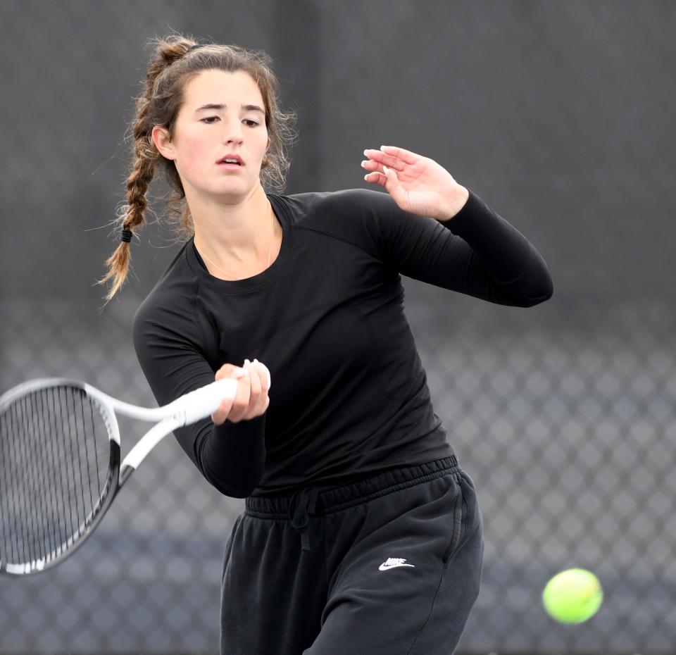 Hoover's Tess Bucher returns a shot against Perry's Haylee Fearon in the Division I sectional finals at Jackson Park Courts, Saturday, Oct. 7, 2023.