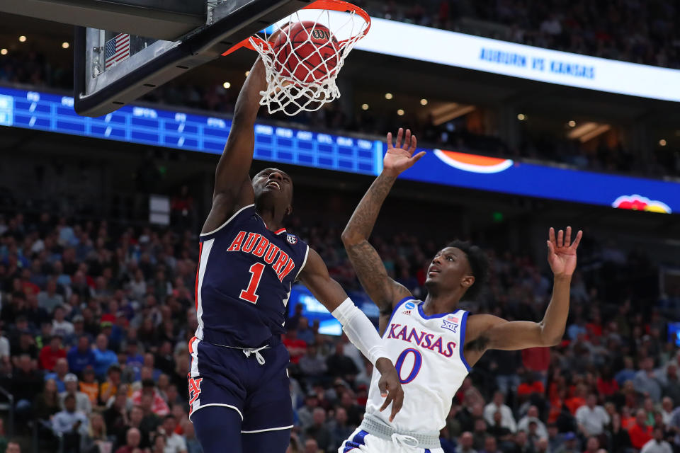 <p>Jared Harper #1 of the Auburn Tigers dunks the ball against the Kansas Jayhawks during their game in the Second Round of the NCAA Basketball Tournament at Vivint Smart Home Arena on March 23, 2019 in Salt Lake City, Utah. (Photo by Tom Pennington/Getty Images) </p>
