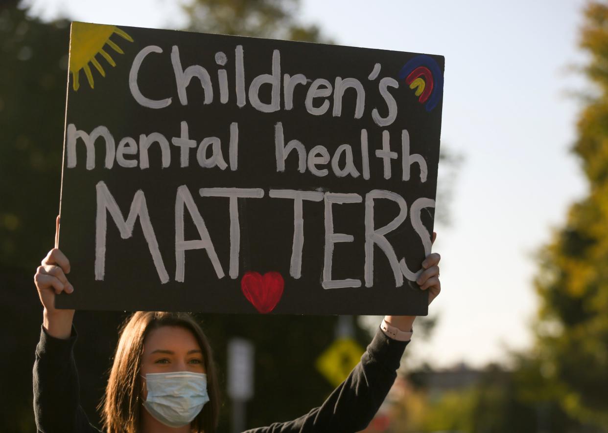 A protester advocates for children's mental health during the Open Oregon Schools rally on Monday, Oct. 5, 2020 at the Oregon State Capitol in Salem, Oregon. 