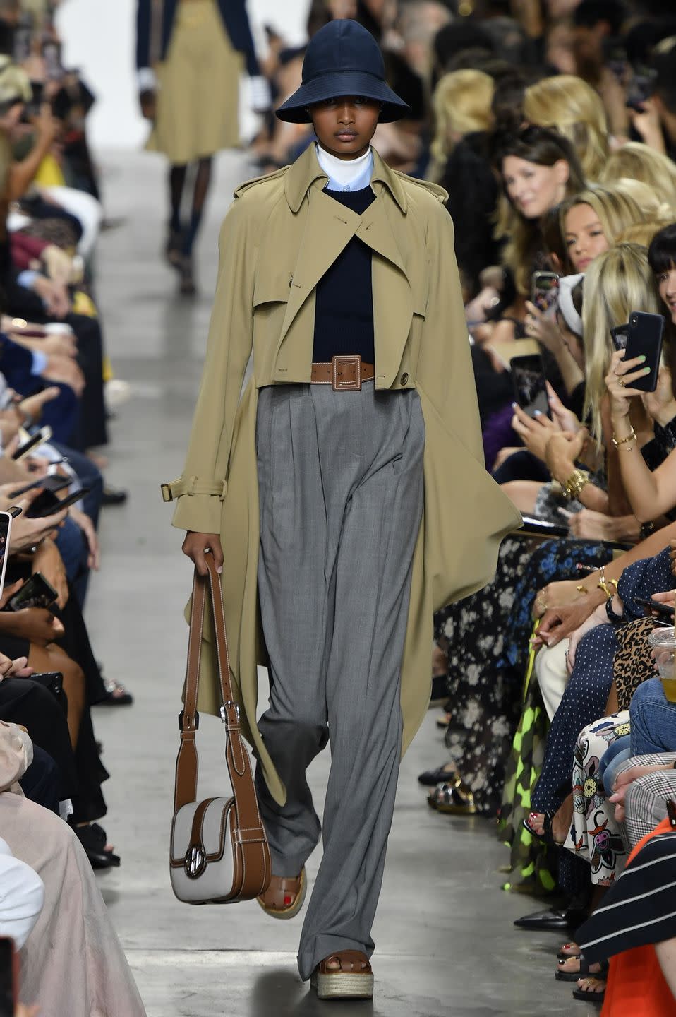 <p>Those with large breasts often worry that they will appear top heavy when wearing skinny-shaped trousers. As a result, this Michael Kors look - high-waisted trousers, and trench coat is perfect as it balance out the model's silhouette and is devoid of buttons or detailing on the coat that could draw your attention to the chest. </p><p>EG Solace London, Orette pleated checked woven wide-leg pants - £290<br><a class="link " href="https://go.redirectingat.com?id=127X1599956&url=https%3A%2F%2Fwww.net-a-porter.com%2Fgb%2Fen%2Fproduct%2F1176999%2FSolace_London%2Forette-pleated-checked-woven-wide-leg-pants&sref=http%3A%2F%2Fwww.elle.com%2Fuk%2Ffashion%2Fwhat-to-wear%2Fg29055066%2Fbig-breasts-runway-looks%2F" rel="nofollow noopener" target="_blank" data-ylk="slk:SHOP NOW;elm:context_link;itc:0;sec:content-canvas">SHOP NOW</a></p>