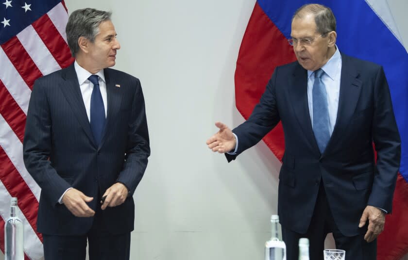 U.S. Secretary of State Antony Blinken, left, and Russian Foreign Minister Sergey Lavrov, right, arrive for a meeting at the Harpa Concert Hall in Reykjavik, Iceland, Wednesday, May 19, 2021, on the sidelines of the Arctic Council Ministerial summit. (Saul Loeb/Pool Photo via AP)