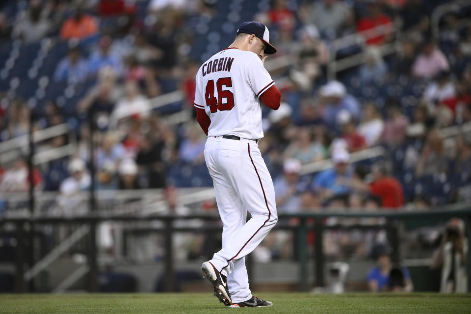 Washington Nationals starting pitcher Patrick Corbin walks back to the dugout after he was pulled during the fourth inning of the team's baseball game against the Philadelphia Phillies, Thursday, June 16, 2022, in Washington. (AP Photo/Nick Wass)