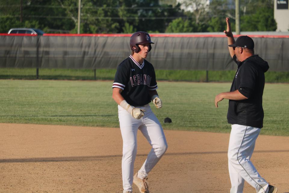 Colton Hartman (5) celebrates a lead-off single during a Division I district championship game on May 25, 2023.