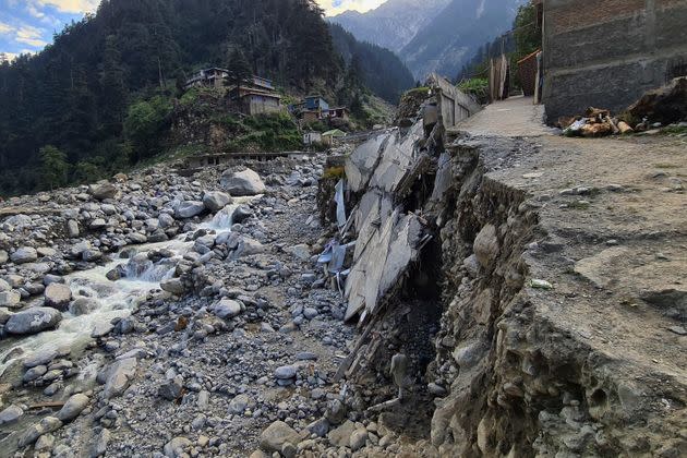 Homes and a portion of road sit destroyed by floodwaters in Kalam Valley in northern Pakistan on Aug. 30, 2022. (Photo: Sherin Zada/AP)