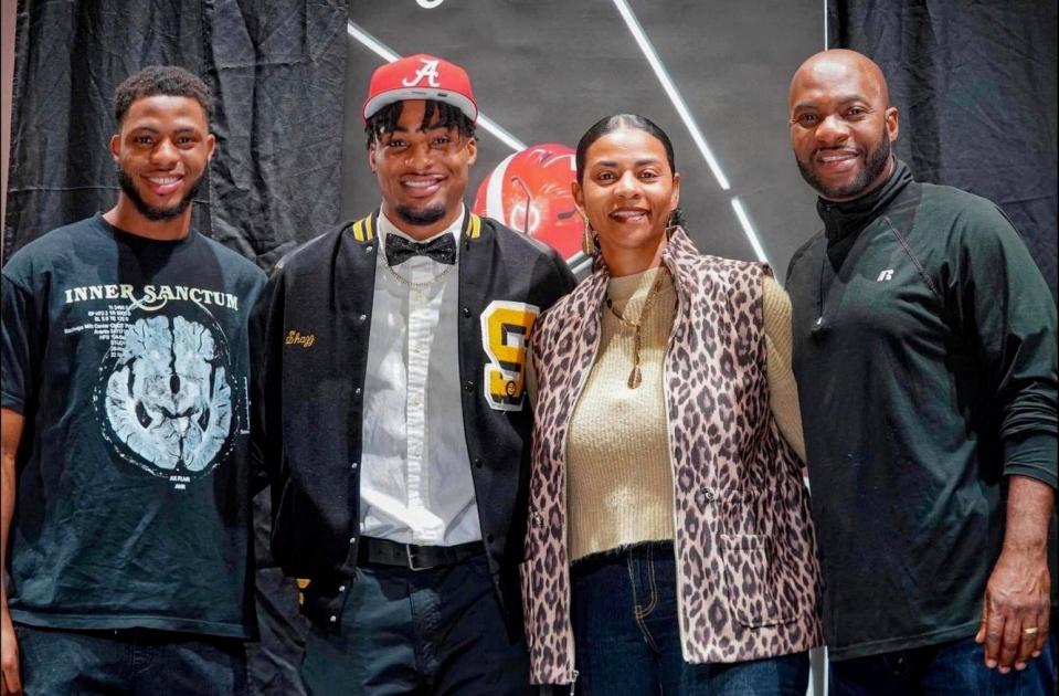 Shawn Preston Sr. (right) poses with his sons Shawn Preston Jr. (from left) and Shazz Preston and his wife Lori Preston during Shazz's signing with the University of Alabama in December.