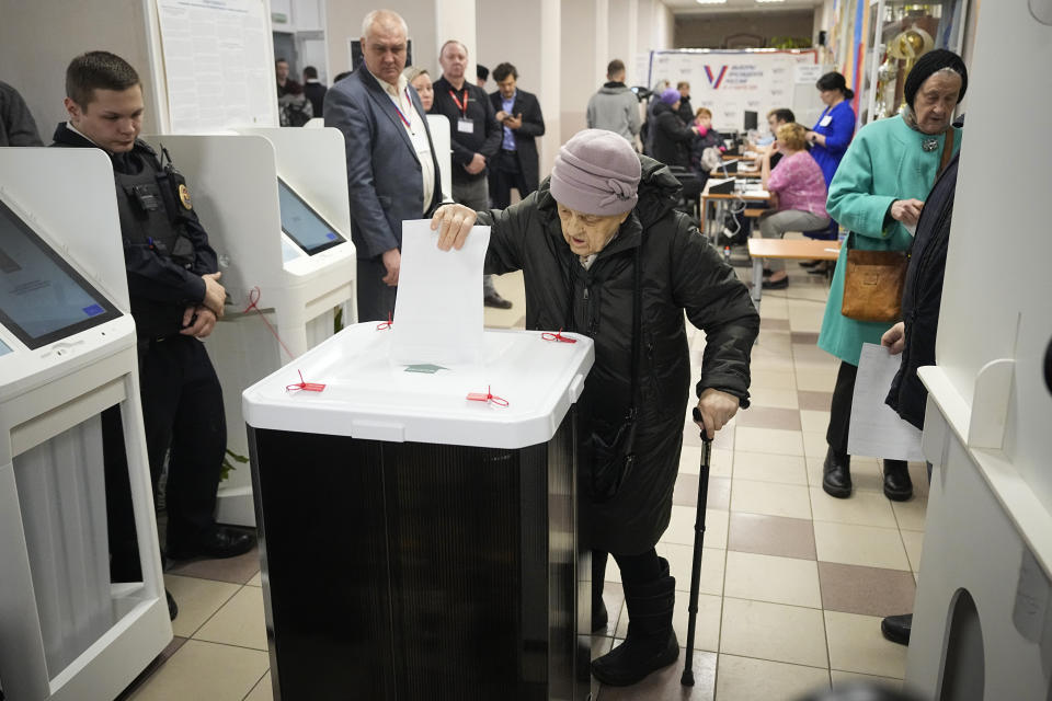 An elderly woman casts a ballot during a presidential election in Moscow, Russia, Saturday, March 16, 2024. Voters in Russia are heading to the polls for a presidential election that is all but certain to extend President Vladimir Putin's rule after he clamped down on dissent. (AP Photo/Alexander Zemlianichenko)