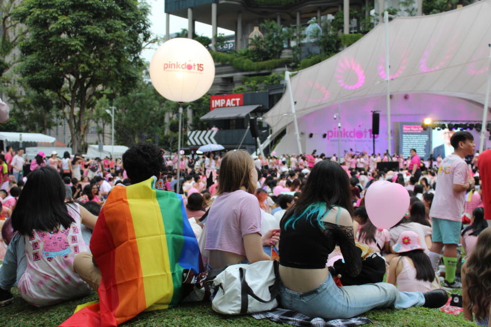 A Pink Dot attendee wears a pride flag at Hong Lim Park in Singapore on June 24, 2023.<span class="copyright">Koh Ewe—TIME</span>