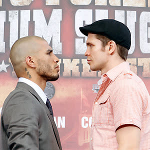 Boxers Miguel Cotto, left, and Yuri Foreman pose together