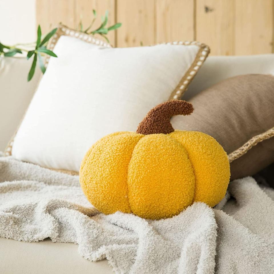 pumpkin-shaped throw pillow