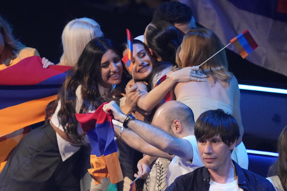 Albina & Familja Kelmendi of Albania celebrates making the final during the second semi final at the Eurovision Song Contest in Liverpool, England, Thursday, May 11, 2023. (AP Photo/Martin Meissner)