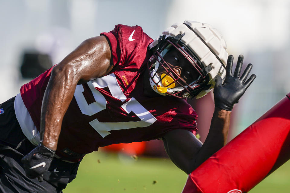 Washington Commanders defensive end Bunmi Rotimi (57) works during practice at the team's NFL football training facility, Thursday, July 28, 2022 in Ashburn, Va. (AP Photo/Alex Brandon)