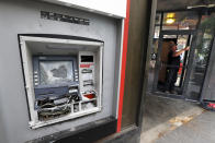 A damaged ATM machine outside a KeyBank branch in downtown Pittsburgh on Sunday, May 31, 2020. Along with the damaged ATM, windows were broken during a march in Pittsburgh, Saturday to protest the death of George Floyd, who died after being restrained by Minneapolis police officers on Memorial Day, May 25. (AP Photo/Gene J. Puskar)