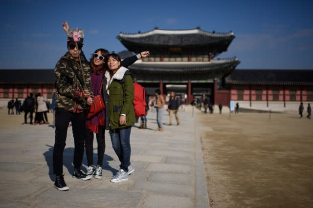 Tourists taking selfies