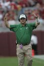 <p>2007 — “Check With Me” pre-snap adjustments at the line of scrimmage, signaled in from the sidelines, start to proliferate. Among the early practitioners: Todd Dodge as head coach at North Texas and Tony Franklin as offensive coordinator at Troy. (Photo credit: AP) </p>