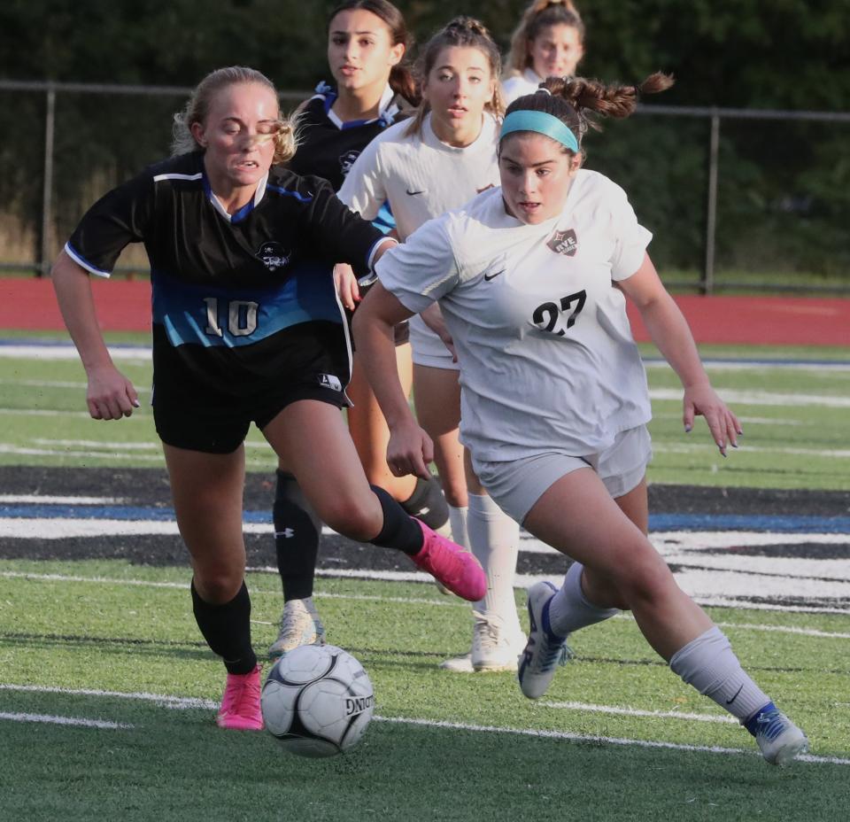 Rye's Maddy Walsh, right, is pressured by Pearl River's Tess Sirakovsky during a game at Pearl River Oct. 16, 2023. Rye won 1-0 on Walsh's goal.