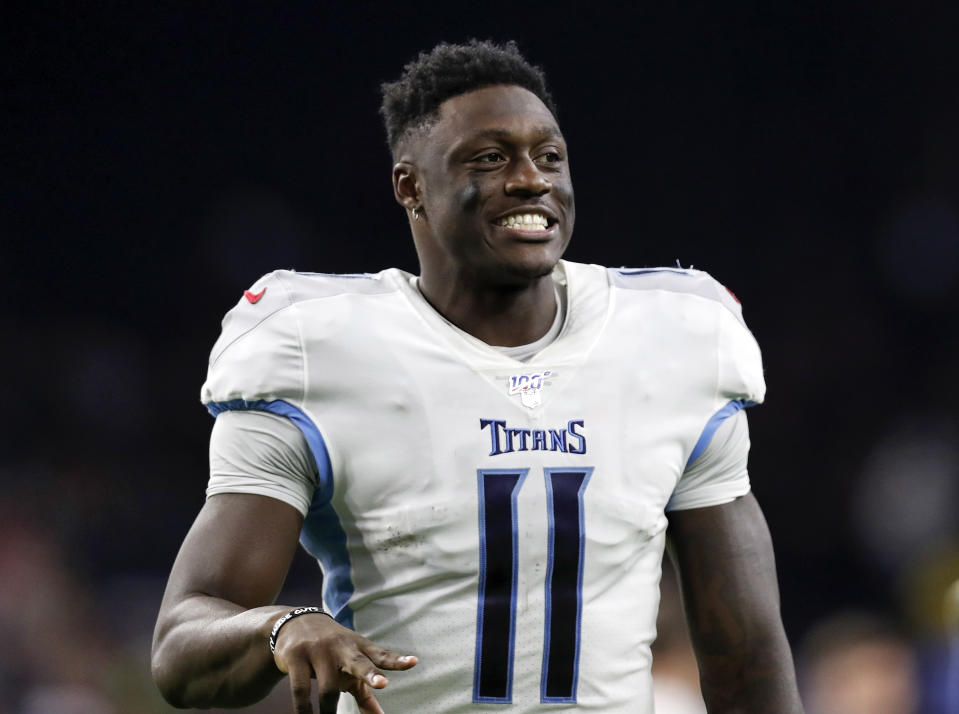 HOUSTON, TX - DECEMBER 29:  A.J. Brown #11 of the Tennessee Titans celebrates on the way to the locker room after the game against the Houston Texans at NRG Stadium on December 29, 2019 in Houston, Texas.  (Photo by Tim Warner/Getty Images)