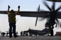 A French Navy Hawkeye reconnaissance plane prepares to take off from the aircraft carrier Charles de Gaulle in the Gulf on February 24, 2015 as part of a campaign against the Islamic State group