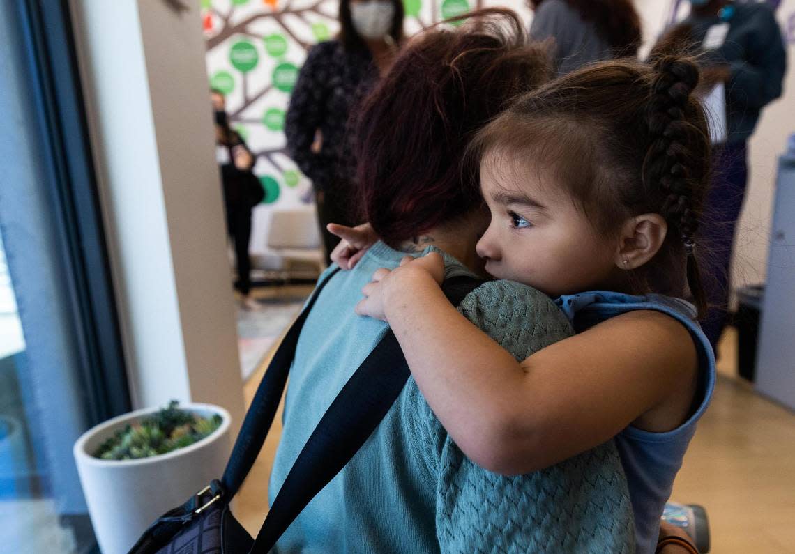 AmandaLyn Rodriguez, 3, hugs her mother Alexandrea Ruiz as she is dropped off at Annie’s Place in October. Her mother, Alexandrea Ruiz, uses the free child care at Annie’s Place so she can get treatment for an advanced stage of cervical cancer at Parkland Memorial Hospital in Dallas.